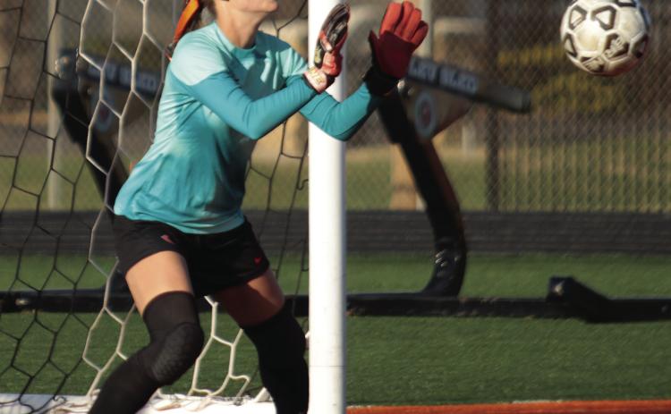 Cushing Lady Tiger goalie Cora Eyeler makes one of eight saves in the Lady Tigers’ match against Ft. Gibson last week. Photos by J.D. Meisner