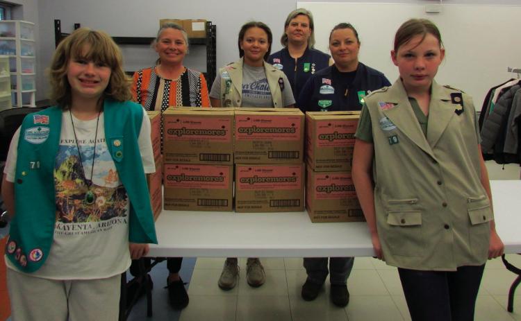 Pictured are Troop members Vivian Richard, Alexa Page, and Teresalyn Parson alongside Troop leaders Karen Schmitt-Page and Laura Green and Cushing Middle School staff member Missy Hogrefe with several boxes of Girl Scout Cookes the troop members decided to donate to the Cushing Middle School food pantry. Additional troop members who were involved in the donation but were unable to be present were Hannah Toops, Sadie Maxwell, Addilyn Fox, Arhyanna Tusler, and Samantha Cantrell. Photos by DeAnna Maddox