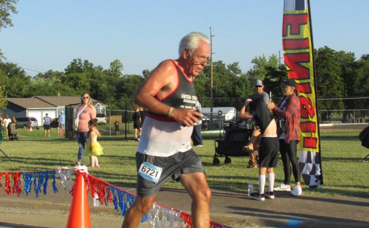 Tyson Branyan — Cushing Rotarian, city commissioner, and Grappler’s Gallop 5K participant crosses the finish line last Saturday, Sept. 30.