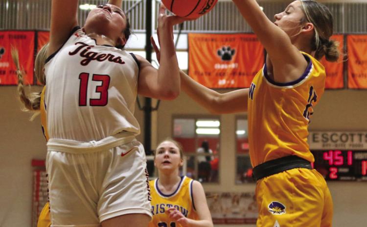 Ella Nanaeto battles for the boards against Bristow Friday. Nanaeto eight points, eight rebounds and four assists.