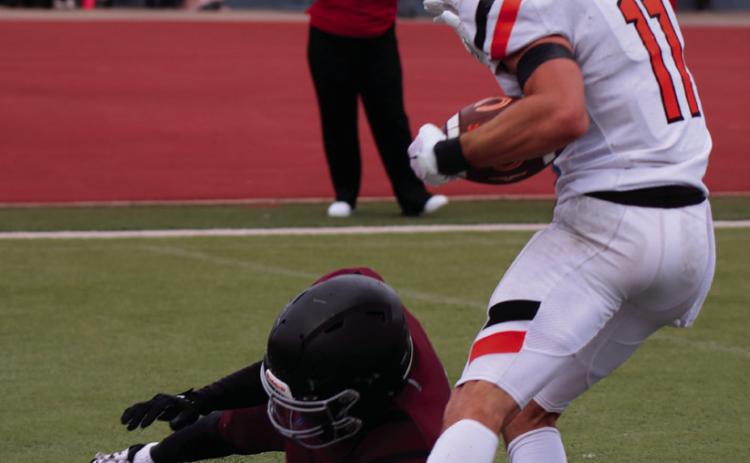 Brady Matheson fights his way toward the endzone Thursday. Photos by Cindy Waylan