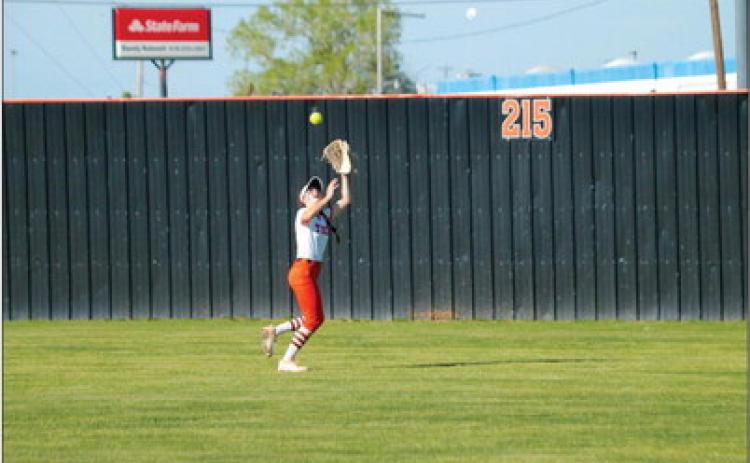 Grab and go Cushing Lady Tiger outfielder Romy Withiam makes a catch during the Lady Tigers game against the Chandler Lady Lions. Cushing destroyed Chandler 14-4 in four innings. Photo by J. D. Meisner