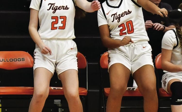 Lady Tigers Tirzah Wade and Makiah Shanklin take full advantage of a good reason to dance as the Lady Tigers put together a complete game and defeated the Yale Lady Bulldogs 58-21 last Thursday, in Yale. See story inside. Photo by Sarah Townes.