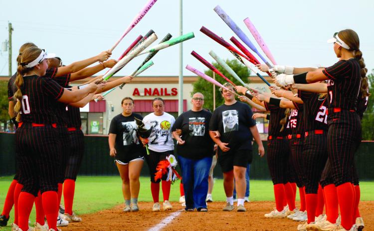 Ava Hebensperger prepares to walk through the bat tunnel with her mom Megan, and her siblings Sophia and Jackson.