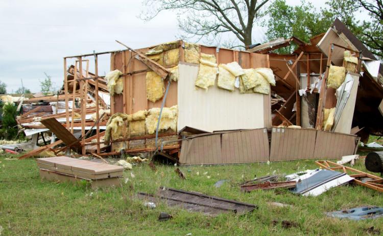 Scrap wood and insulation is all that remains of a vacant mobile home on Kimberly and Jeff Willson’s property near Ripley after a strong F1 tornado touched down Monday. Photo by J. D. Meisner