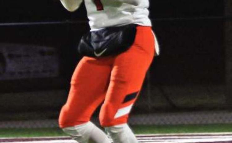 Blaze Berlowitz under the lights in Blanchard Friday. He threw for 180 yards and two touchdowns against the Lions.