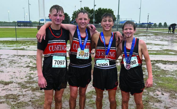 Junior High Cross Country Tigers Brice Bozworth, Keston Worthy, Gage Hoover and Hutson Calavan, soaked through, after their race Thursday. Hoover placed first, Worthy sixth, and Calvin 21st. The junior high boys were fourth overall as a team.