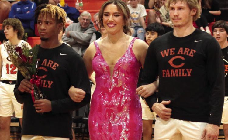 Noah Jones and Camden Crooks escorting Tatum Caulfield.