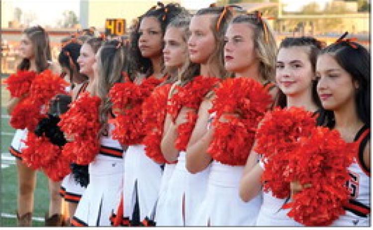 The Tiger spirit squad listens to the National Anthem. Photo by Sylvia Danyele
