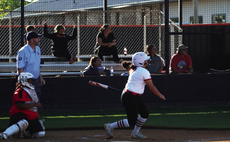 Everybody watches Ava Hebensberger’s solo home run gain altitude. Where did it go? Read the story on page 5 to find out. Photo by J. D. Meisner
