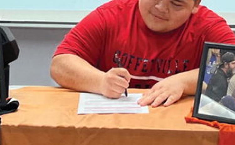 Nic “Panda” Flores signs his letter of commitment to continue his powerlifting and academic career at Coffeyville Community College in Coffeyville, Kansas.