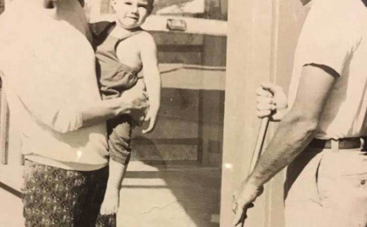 Gary remodeling his first Cushing Clinic (on North Little) in 1974 as Roz, Geoff and future daughter Heather look on.