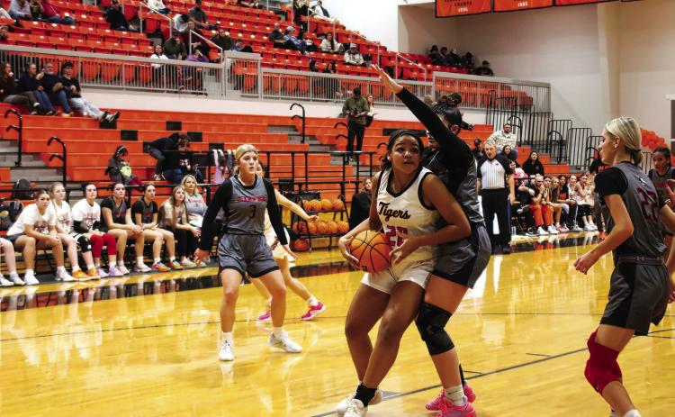 Makiah Shanklin hooks an elbow and gets past a Kiefer defender. Photo by J. D. Meisner