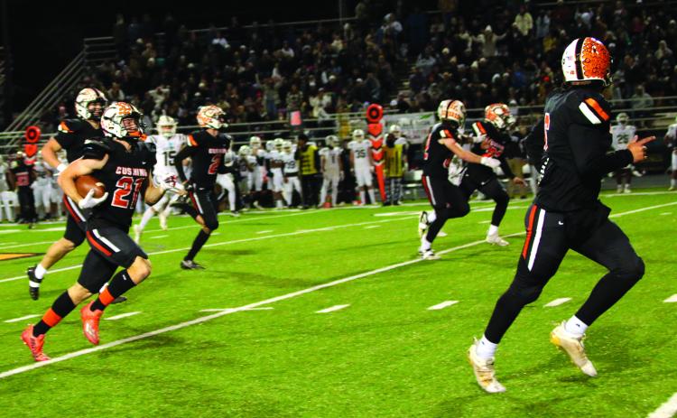 Camden Crooks, flanked by a host of Tiger blockers returns a punt to score Cushing’s fifth touchdown against the Elk City Elk.