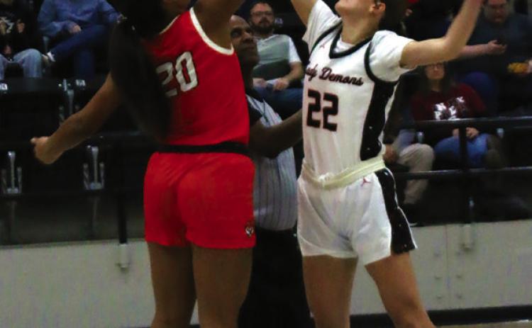 Lady Tiger Ella Nanaeto contests the opening tip against Perkins’ Brynn Stone Friday.