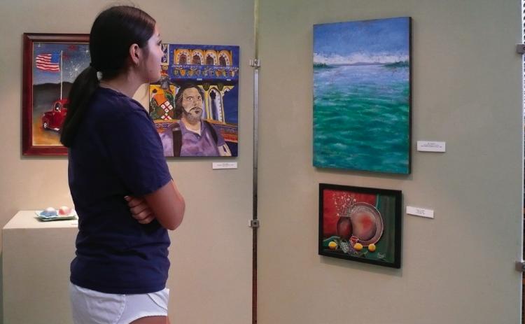 Timbraly Shadowen views the exhibit