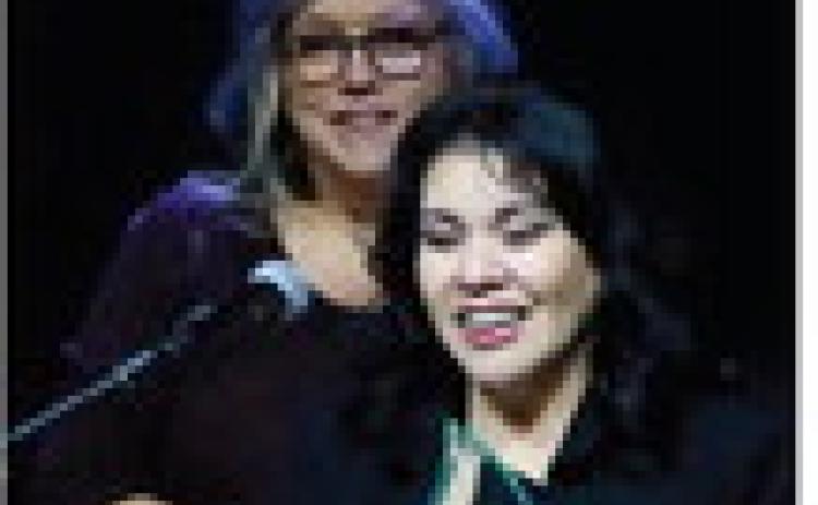Elvia Bustos accepts the Cushing Chamber of Commerce Small Business of the Year Award while Vera Huckabay offers congratulations. Photo by J. D. Meisner