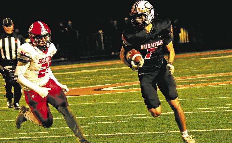 Cushing’s Roman Tucker turns up field en route to a first down Friday against Skiatook.