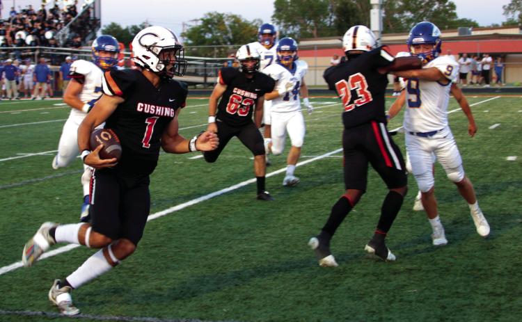 Tiger quarterback Blaze Berlowitz heads for the goal line on a Red Zone touchdown run.