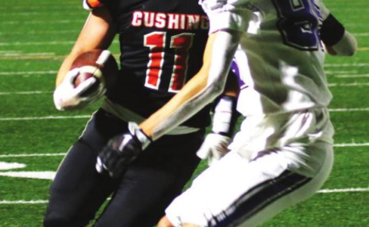 Cushing fullback Hayden Fry looks a Broncho defender in the eye before going right through him.