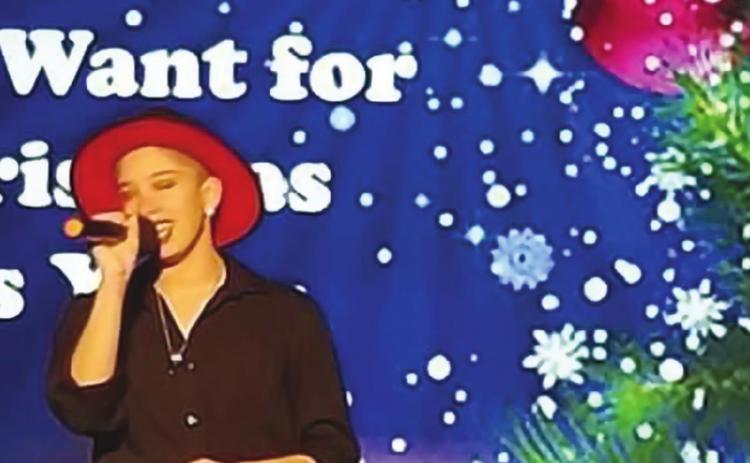 Top: Aubri Crumpton performs at Cushiung COmmunity Theater’s The Magic of Christmas.