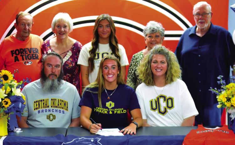 Senior Cushing Tiger athlete Karly Clemons recently signed a letter of intent to run track for the UCO Broncho track and field team.Joining Carly at the signing event were, back row from left, grandparents Cliff and Vickie Case, cousin Jaylee Matthews and grandparents Joy and Don Kindley. Front row from left, father Gunn Clemons, Karly Clemons and mother Crissy Kindley.