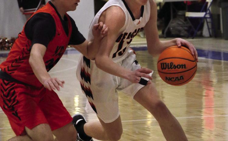 Agra Bearcat Landon Toles drives past a Yale defender during the Bearcats game against the Bulldogs at the Glencoe “Coaches vs Cancer” Tournament this past weekend. Photo by Allie Prater