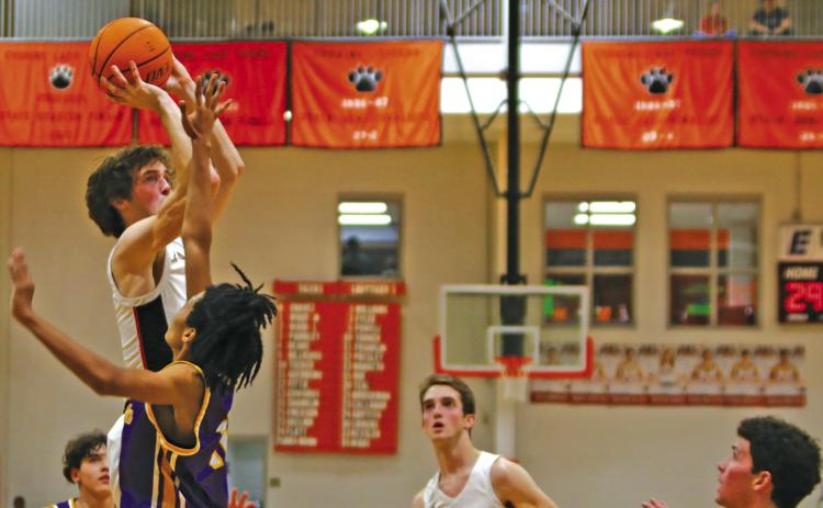 Max Wood puts up a shot in traffic Friday as the Cushing Tigers pick apart the Bristow Pirates 86-28 in front of a homecoming crowd. Cushing advances to 10-6 on the season and will host the Mannford Pirates Friday. Photo by Amber Fausto
