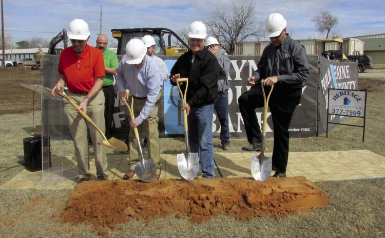 A groundbreaking ceremony for Payne County Bank’s upcoming Cushing location was held on Feb. 24. The anticipated opening date for the new business is Sept. 1 and will offer Saturday banking services. Lynn Kinder explained the bank will be 100 percent employee owned; he said, “It will not only be located in the community but will be a part of the community”. Pictured from left are Kinder, Heritage Construction Co. Contractor Dusty Lane, Richard Rogers, and Chris Peterman. Photo by DeAnna Maddox
