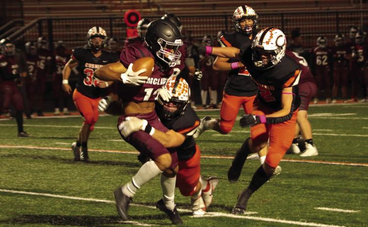 Tiger seniors Riley Matheson and Lane Yaunt bring down a McLain Titan ball carrier during the first half of Cushing’s 63-8 thumping of the Titans. Matheson and Yaunt were part of an impenetrable barrier also known as the Tiger defense Friday. Photo by J. D. Meisner