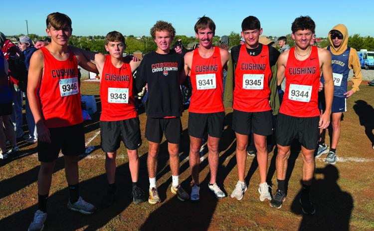 Tiger runners Aaron DeLong, Kaden Pendergraff, Fisher Moore, Kamden Evans, Kyler Claxton and Austin Kennedy, before their race at Bridge Creek. Evans finished sixth overall, qualifying for state with a personal best time and setting a new school record.