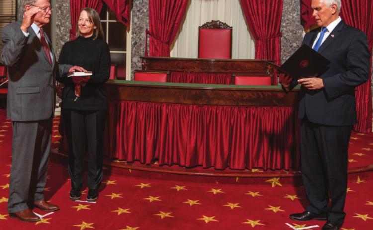 Right: Senator Jim Inhofe is sworn in for the 117th congress, accompanied by his daughter, Molly Rapert.