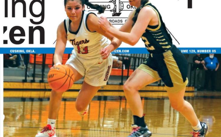 Lady Tiger Ella Nanaeto drives to the rim in the Cushing Lady Tigers final game of the season against the Woodward Lady Boomers. Cushing lost to the 11-16 Lady Boomers 38-41. Photo by Amber Fausto