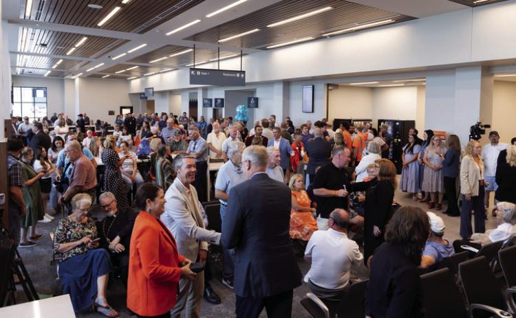 People gather to celebrate the grand opening of the new terminal at Stillwater Regional Airport Wednesday, Aug.19. Photo by Eric Priddy.