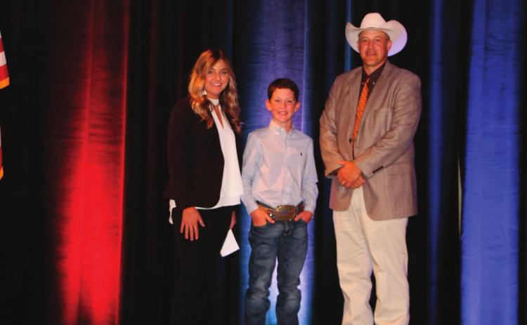 Outgoing OJCA President, Sarah Armitage (left) and Mike Weeks, OCA President (right) pictured with Kelton Arthur, 2020 OJCA All-Around Junior Cattleman of the Year.