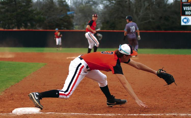 With the ball in the glove and a foot on the base, Cushing’s Ethan Evans makes what should have been an impact-play at first. The umpires saw it the other way and called the Jones runner safe at first.