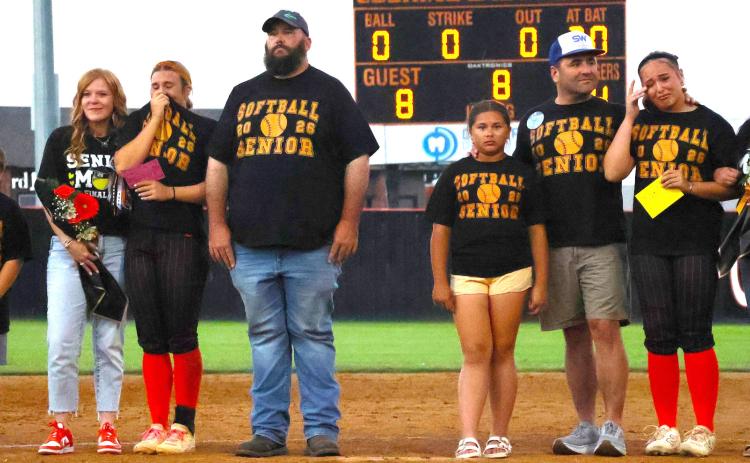 Emotions overcome CHS senior softball players Gracyn Presley and Faith Kesler as they stand on the infield with their families during senior night recognition last week. Photo by Sylvia Danyele