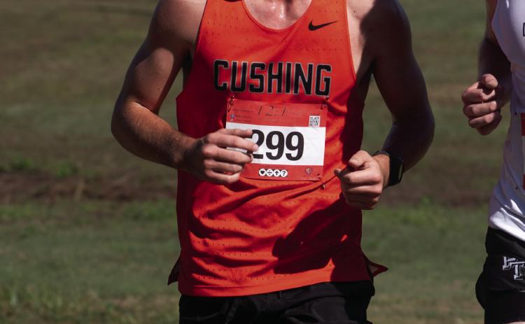 Kamden Evans runs at the Stroud meet. Photo by Sarah Townes