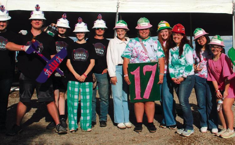 Cushing High School aeronautics Team 17 and Team 18 members stand with their instructor Dr. Jessica Sigle at Speedfest XV in Stillwater.