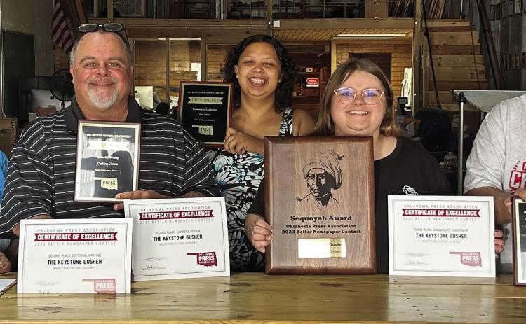 The staff at Cimarron Valley Communications show off some of the hardware they brought home from the Oklahoma Press Association Convention this past weekend. Pictured are, Business Manager and Layout Artist Sapphire Smith, Publisher J. D. Meisner, Lead Reporter DeAnna Maddox, Group Editor Allie Prater and Sports Analyst Robert “Tornado Watch” Marshall. Photo by Raynee Howell