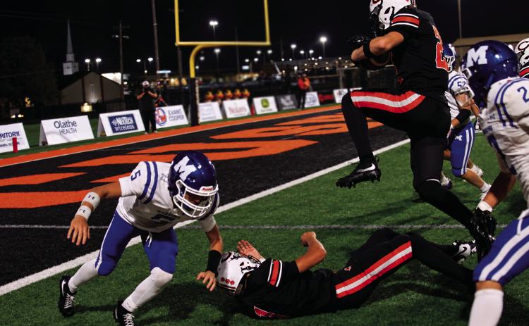Drew Wood makes his own way toward the endzone against Miami Friday. Photo by J. D. Meisner