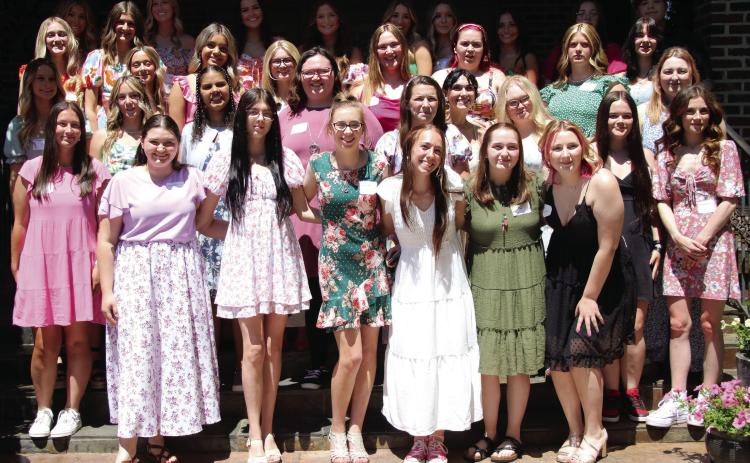 CHS senior girls enjoy the warm weather Monday, April 29, at the Senior Tea fashion show hosted by the Geographic Club of Cushing. Photo by Allie Prater