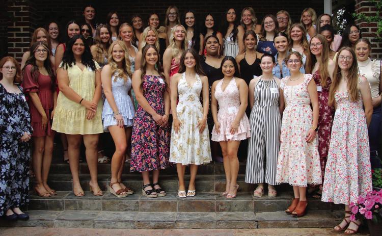 The young women of the class of 2025 gather on the steps of Betsy Hibbard’s home Monday, April 28, during the 105th annual Cushing Geographic Club Senior Tea. See more photos on page 9. Photo by Allie Prater.