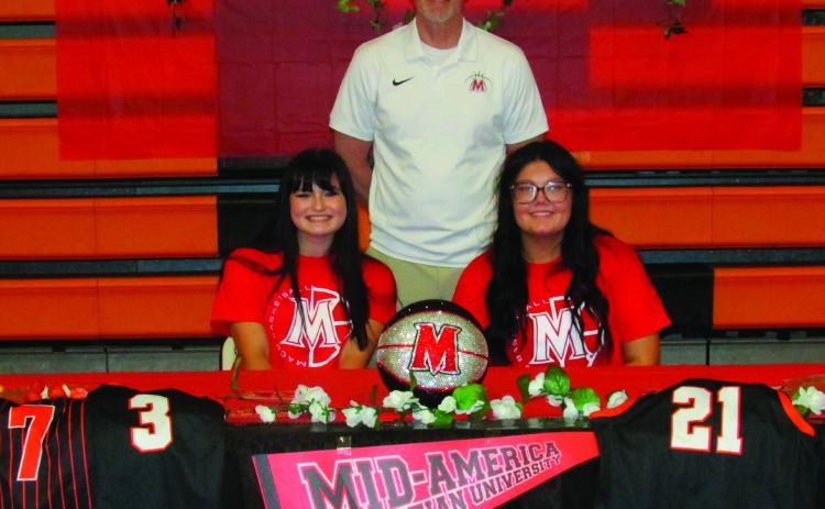 MACU Representative Scott Morris stands with Rylie Pendergraff and Jaylee Thomas following their signing ceremony held on May 12. Photos by DeAnna Maddox