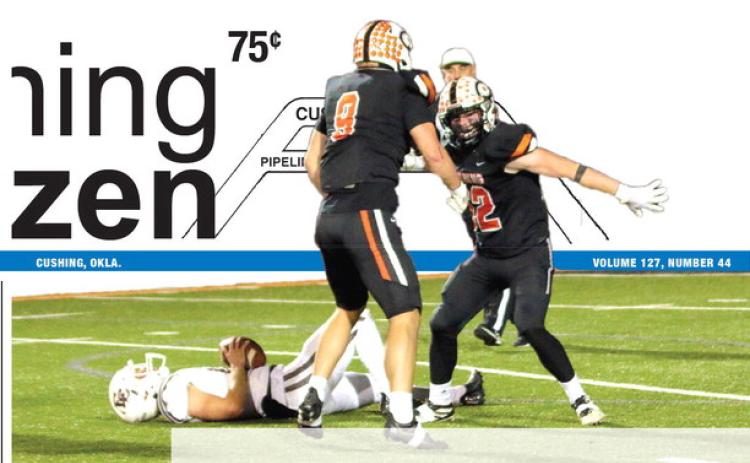Cushing defensive tackle Connor Moreland and outside linebacker Jake Horn celebrate a sack of Elk quarterback Austin Jones, Friday, during the Tigers’ 56-14 mauling of Elk City. Cushing’s defense played a pivotal role in the win that propelled the Tigers to the Class 4A state final, which will be played against Wagoner at UCO in Edmond this Saturday at 7 p.m.