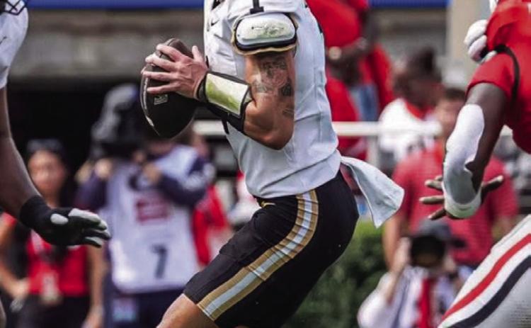 Blaze Berlowitz drops back for a pass versus the Georgia Bulldogs.