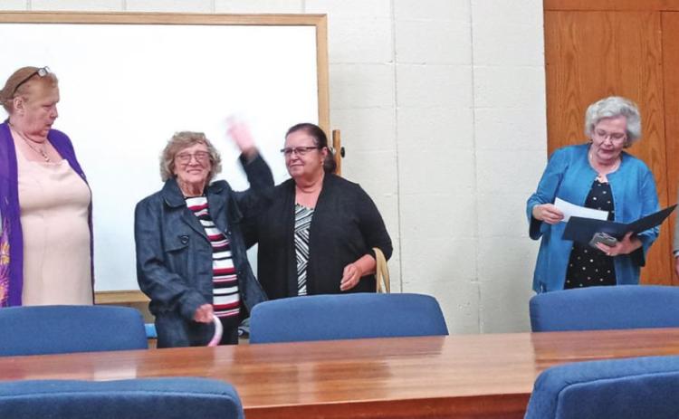 Judy Grotts with Cushing Commission Chairman B.J. Roberson, as she accepts the proclamation decree and introduces the garden club committee.