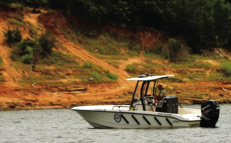 Trooper Ryan Griffith of the OHP’s Marine Division patrols the Cimarron Arm of Keystone Lake near Appalachia Bay Recreation Area Friday. Griffith was among the first to respond to July 4’s double drowning at Keystone. Photo by J.D. Meisner