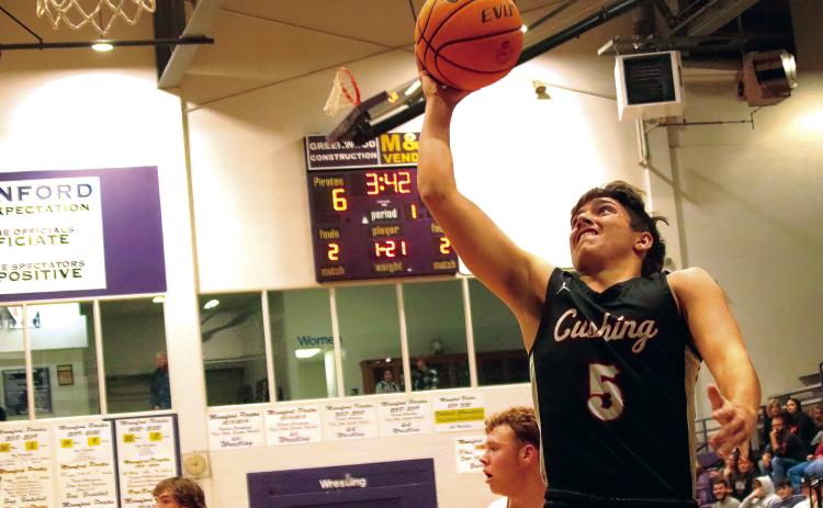 Johnny Hilligoss charges in for a layup.