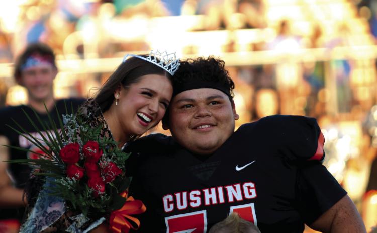 Cushing Homecoming Queen Georgia Griffeth and King Nicholas “Panda” Flores enjoy their moment during homecoming festivities held Friday, prior to the Tiger’s rout of Berryhill, at O’Dell Field. Photo by J. D. Meisner